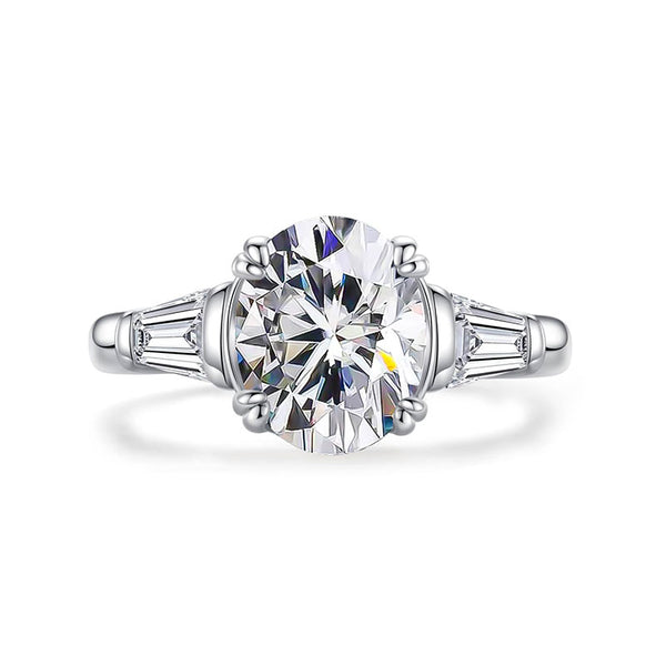 Three Stone Oval Moissanite And Tapered Baguette Engagement Ring
